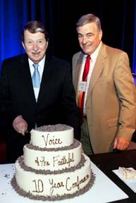 Jim Post and Mark Mulaney cut 10th Year Conference cake.